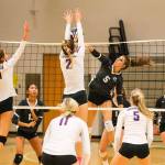 The Issaquah Eagles cruised to a 3-0 victory against the Skyline Spartans in a rivalry matchup on the volleyball court on Oct. 3 in Sammamish. Issaquah junior Maya Patton, (No. 2), leaps into the air for the block at the net against Skyline. The Eagles improved their overall record to 7-1 with the victory. Photo courtesy of Rick Edelman/Rick Edelman Photography