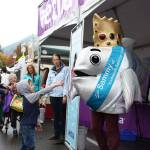 The Salmon Days mascot, Sammy, waves to a boy during the 49th annual celebration. Aaron Kunkler/staff photo