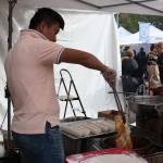 An employee makes elephant ears at Rays Elephant Ears on Sunday. Aaron Kunkler/staff photo