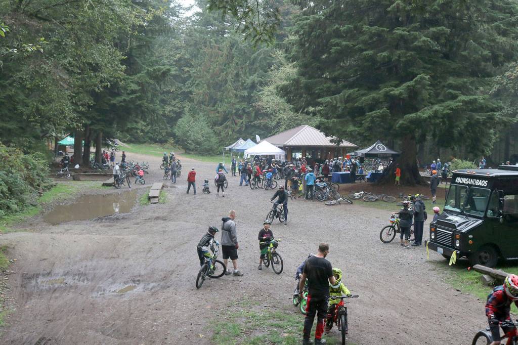 Bikers gather at the clearing in Duthie Hill Park for food, activities, and games. Evan Pappas/Staff Photo