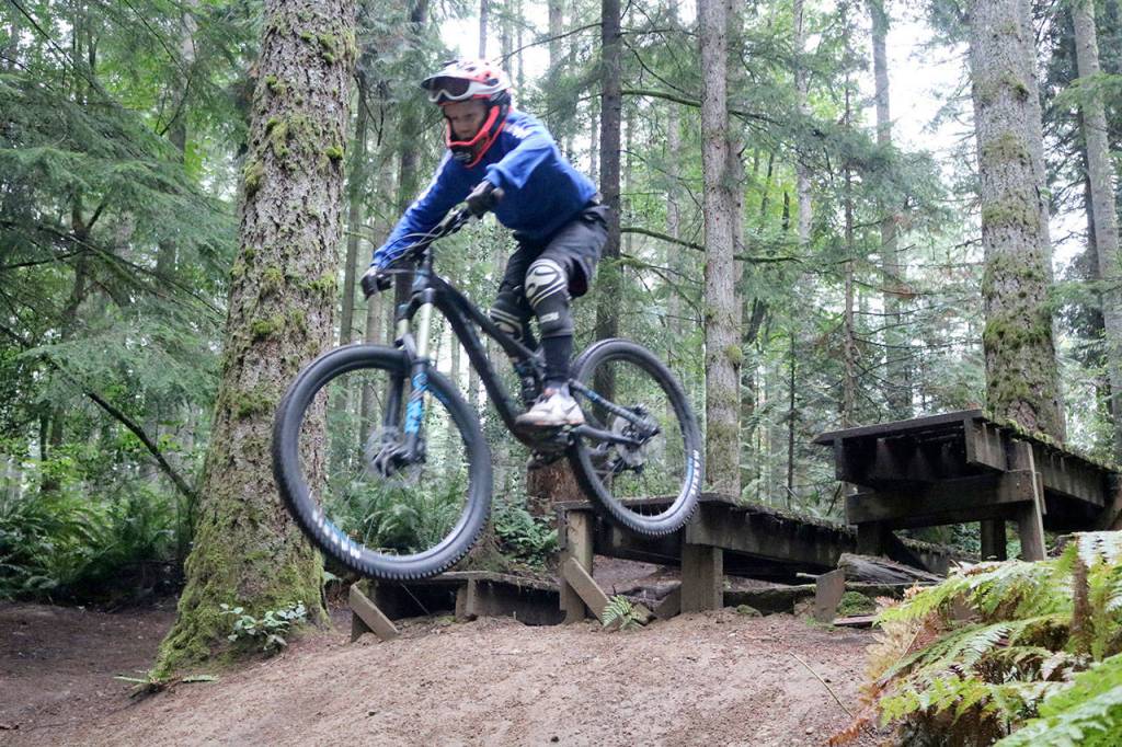 A riders takes a speedy jump in the Duthie Hill Park trails. Evan Pappas/Staff Photo