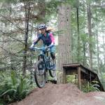 Riley Hudson, Sweetlines rider, lands a big jump on the Voodoo Child trail. Evan Pappas/Staff Photo