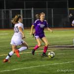 Issaquah Eagles junior midfielder Jenna Wisler, center, carries the ball up the field against the Eastlake Wolves in a matchup between rivals on Oct. 11. Photo courtesy of Don Borin/Stop Action Photography