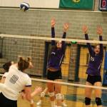 Issaquahs Sadie Bacon, middle left, and Abby May go up for a block against North Creek. Andy Nystrom / staff photo