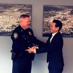 Bellevue city manager Brad Miyake welcomes Steve Mylett back to his position as police chief following his exoneration. Photo courtesy of the city of Bellevue