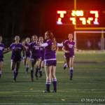 Issaquah Eagles girls soccer players make a beeline for Riley Larsen, who is standing with her arms outstretched, after she hit the game clinching penalty kick in the overtime shootout on Nov. 1 at Gary Moore Stadium in Issaquah. Photo courtesy of Don Borin/Stop Action Photography