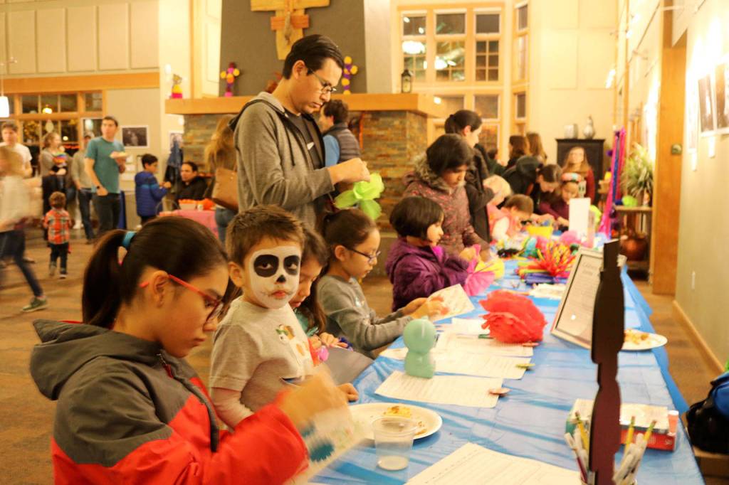Franco Esquivel looks up after working on his arts and crafts along with many of the other kids at the event. Evan Pappas/Staff Photo