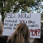 Skyline High School students and community protest perpetuation of rape culture following ISD lawsuit. Student holds sign that says ISD…How would you like to be kept in class with your rapist? Madison Miller/staff photo.