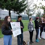 Skyline High School students and community protest perpetuation of rape culture following ISD lawsuit. From left: 2017 Skyline HS graduate, Sophie Truax, and senior Ayush Varadhan. Both holding a sign that says Make ISD Accountable Again. Madison Miller/staff photo.