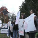 Skyline High School students and community protest perpetuation of rape culture following ISD lawsuit. Sasha Burckhardt, senior, holds a sign that reads, ISD: Talk about rape, dont hide it. Emily Tang and Teesoo Yoon, seniors, holds a sign that reads, What causes rape? Rapists. Madison Miller/staff photo.