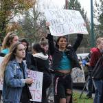 Skyline High School students and community members protest perpetuation of rape culture following a lawsuit aginst the Issaquah School District. Left: Chloe Strandwold, senior and organizer of protest; center: Amelia Danyuk, senior, holds sign saying Dont Tell Me How to Dress! Tell Them Not to Rape. Madison Miller/staff photo.