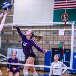 Issaquah senior outside hitter Liz Gorski (pictured) hits the ball over the net, keeping the play alive against Glacier Peak. Issaquah defeated Glacier Peak 3-0, clinching a berth in the Class 4A state volleyball tournament on Nov. 16-17 at the Yakima SunDome. Photo courtesy of Don Borin/Stop Action Photography