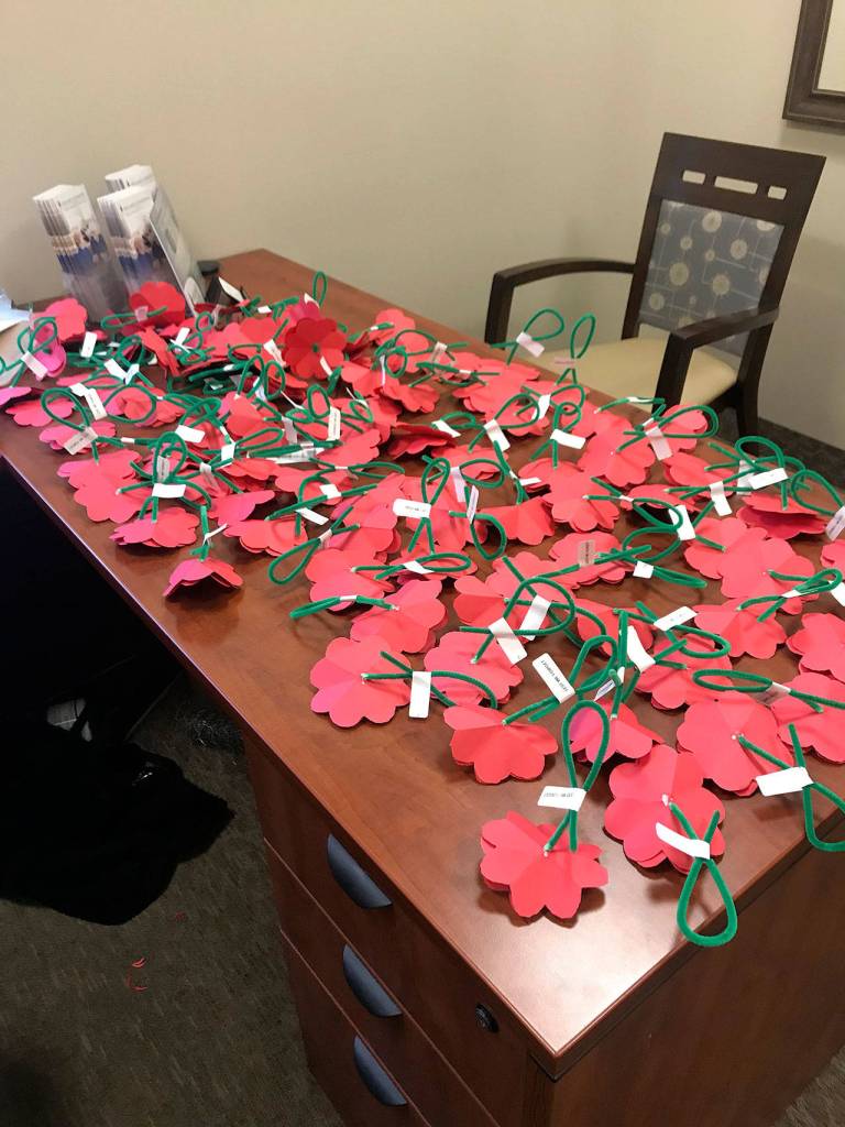 Spiritwood residents handmade 200 poppy flowers and handed them out at the local QFC, gathering about $200 for the Veterans Association throughout the day. Photo courtesy of Jennifer Angell