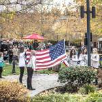 Girl Scout Troop 43975 raised the American flag as a traditional part of this Veterans Day ceremony. Photo courtesy of Dennis Crane/DBC Photo.