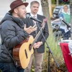 Kurt Dyrhsen, Music Director at Sammamish Presbyterian Church, led the attendees in song, first with Its a Long Way to Tipperary, a traditional WWI march song, and American the Beautiful. MC Dr. Paul Dean is looking on. Photo courtesy of Dennis Crane/DBC Photo.