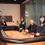 Snoqualmie Casino staff members (from left) Trevor House, Linda Yem, Sophorn Seng, Ross Garmon and Jan Wu surround a gaming table in the new private gaming room at Snoqualmie Casino. Photo courtesy of Tarah Smigun