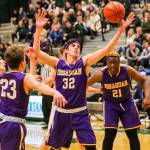 In showdown between rivals, the Issaquah Eagles boys basketball team rose to the occasion. Issaquah registered a 81-64 victory against the Skyline Spartans on Dec. 7. The Eagles improved their overall record to 2-3 with the victory. Issaquah sophomore Charlie Dietiker, center, corrals a rebound against the Spartans in the win. Photo courtesy of Rick Edelman/Rick Edelman Photography