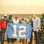 From left, Randall Morris, Alonzo Mitz, Lofa Taupu, Suzanne Perkins Newman and Dave Wyman pose with Issaquah Mayor Mary Lou Pauly on Dec. 14. Stephanie Quiroz/staff photo.