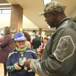 An Issaquah senior is starstruck as Alonzo Mitz signs an autograph.
