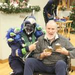 Rooster and Don smile for the camera at the 12 Days of Goodness Seahawks Legends Events on Dec. 14. Stephanie Quiroz/staff photo.