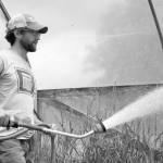 Ryan Lichttenegger waters plant starts at Steel Wheel Farm outside of Fall City. Lichttenegger was then a tenant farmer and hoped to one day purchase his own land. Aaron Kunkler/Staff photo