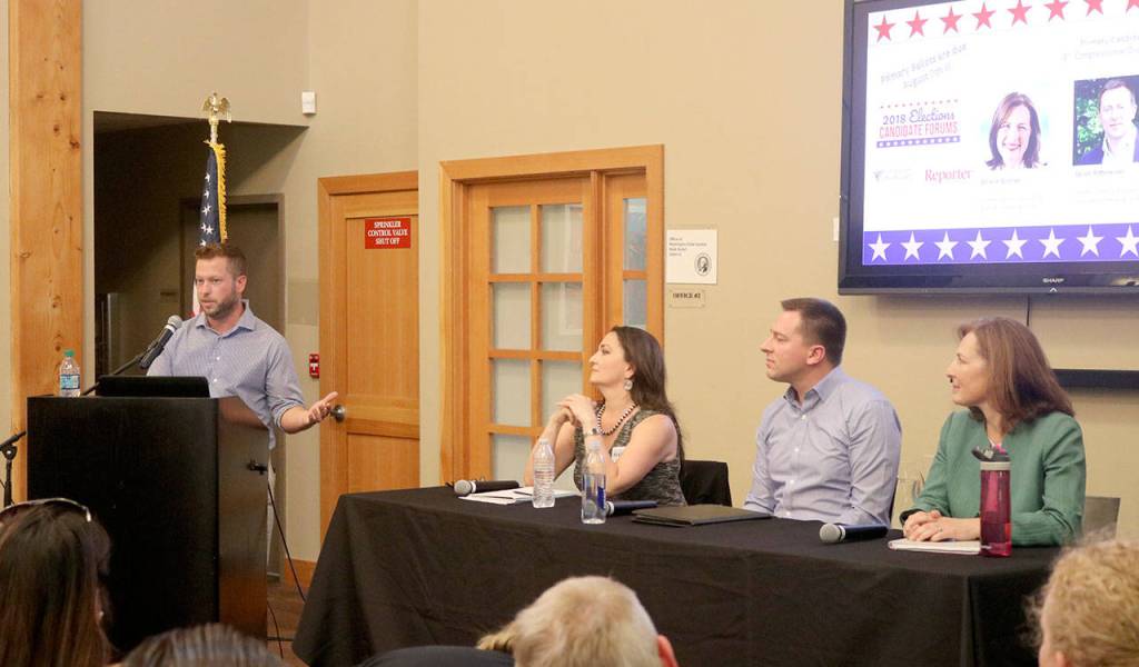 Nate Perea moderated the forum and asked the candidates questions on seven topics throughout the night. Evan Pappas/staff photo