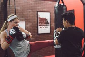 9Round trainer Cisco helps train trainer Staci at Truong Luus Issaquah Highlands location which recently celebrated a year of operation. Photo courtesy of Truong Luu and 9Round