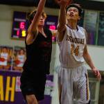 Issaquah Eagles senior Jonathan Lo (pictured) attacks the basket against the Mount Si Wildcats. Mount Si defeated Issaquah 74-49 on Jan. 25 at Issaquah High School. Photo courtesy of Don Borin/Stop Action Photography