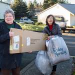 Founder of Everyone for Veterans, Theresa Cheng helps Alice Richard deliver a mattress to a veteran family in Federal Way as part of the Wingman Project in Dec. 2018. Photo Courtesy of Everyone for Veterans.