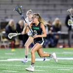 Issaquah sophomore McKenna Minnoch (pictured) carried the ball down the field against the Wolverines. Photo courtesy of Rick Edelman/Rick Edelman Photography