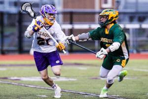 Issaquah senior Spencer Berntsen, left, scored two goals in his teams 11-3 win against Roosevelt on March 22. Photo courtesy of Rick Edelman/Rick Edelman Photography
