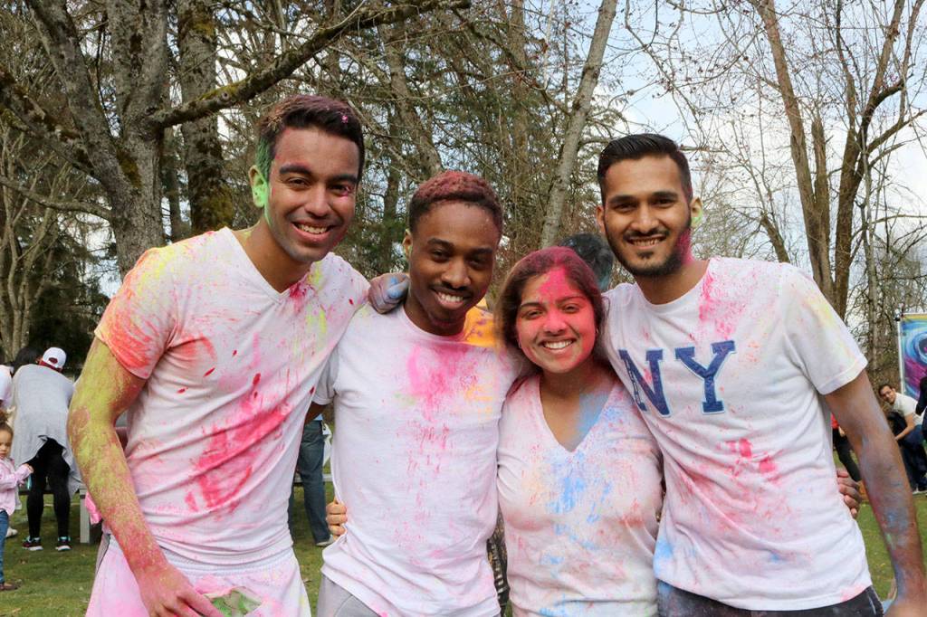A group of friends celebrate Holi at Lake Sammamish Park. From left: Kai Lake, Ephraim Elongo, Taniya Lake, and Abhi Trivedi. Evan Pappas/Staff Photo