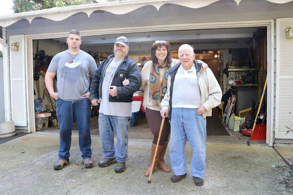From left: John Hayes, John Hayes, Lee Anna Hayes, and Dale Brown. The Issaquah family has known Dale Brown for 15 years. They consider him family. Stephanie Quiroz/staff photo