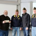 Members of the VFW Post 3436 gathered at Issaquah City Hall to present new member Kent Paxton with a Vietnam Veteran Lapel Pin. From left: Kent Paxton, David Waggoner, Dean H. Van Dyke, and Ivan Lee. Evan Pappas/Staff Photo