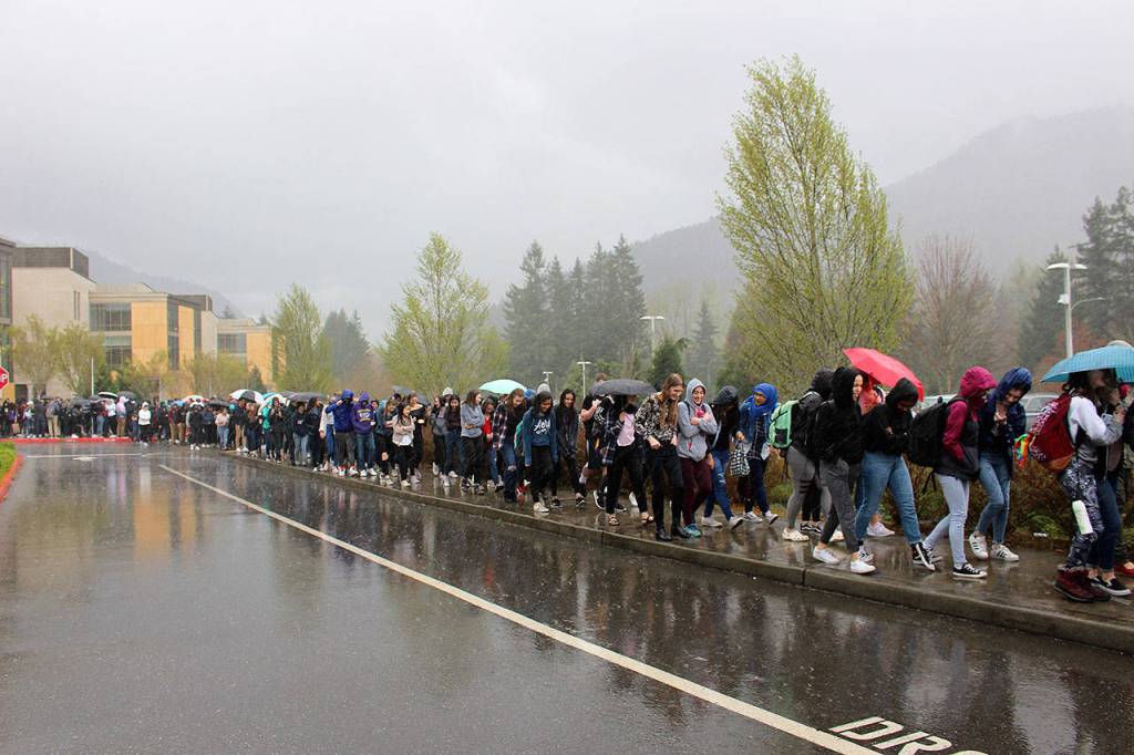 Over 200 students walked out at 12:15 on Wednesday after a photo of two students holding a racist sign went viral. Madison Miller / staff photo