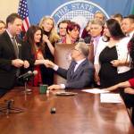 Gov. Jay Inslee shakes hands with Dinah Griffey after signing Senate Bill 5649 on April 19. The law revises the statute of limitations for sex crimes. Photo by Emma Epperly, WNPA Olympia News Bureau