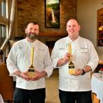 Greater Issaquah Chamber of Commerce / courtesy photo                                Snoqualmie Casino executive chef Justin Lee (right) and pastry chef Chuck Dugo (left) hold the awards they won for creating the native berry-based dessert for the Issaquah Epicurean Experience contest.