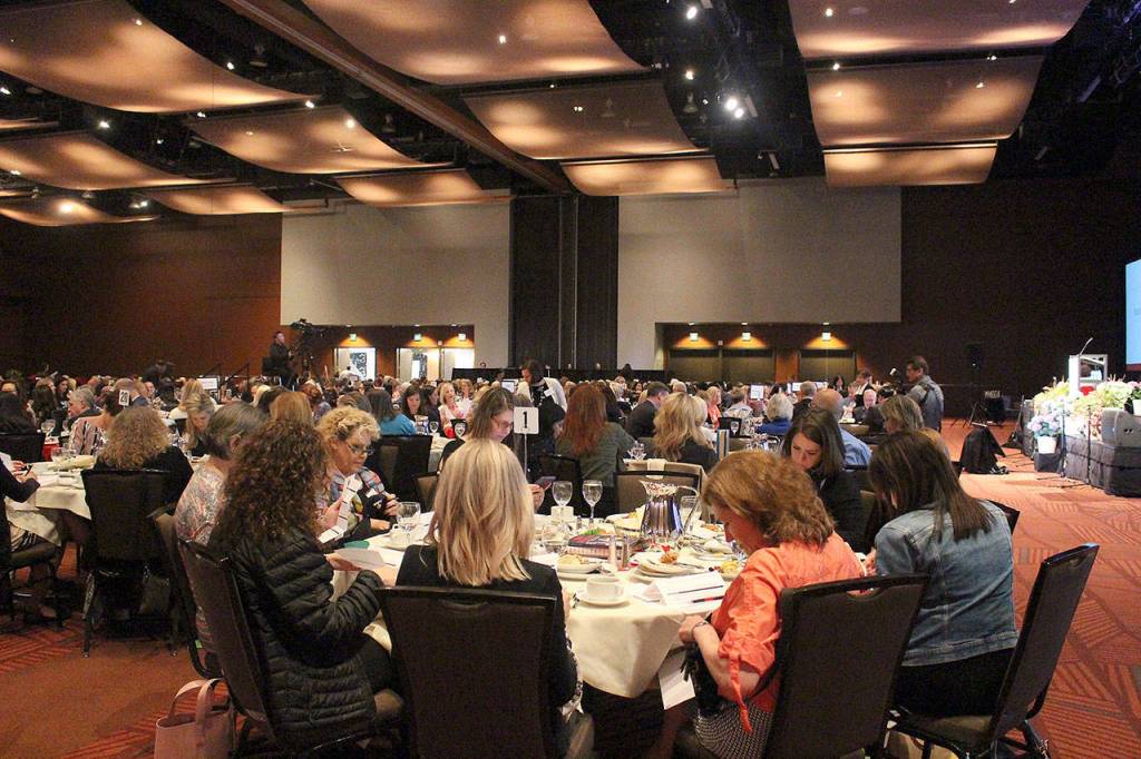 Madison Miller / staff photos                                Luncheon attendees fill out donation forms at the end of the Nourish Every Mind Luncheon on May 3.