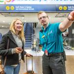 Airport Pathfinder, Evan Larson, helping travelers at Sea-Tac.