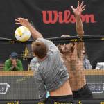 Jeremy Casebeer blocks a shot attempt by Taylor Crabb during the 2019 AVP Seattle Open mens championship match on June 23 at Lake Sammamish State Park. Photo courtesy of Robert Beck