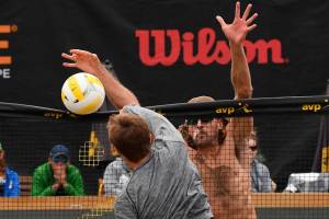 Jeremy Casebeer blocks a shot attempt by Taylor Crabb during the 2019 AVP Seattle Open mens championship match on June 23 at Lake Sammamish State Park. Photo courtesy of Robert Beck