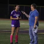 Sportswriter Shaun Scott interviews an Issaquah Eagles girls soccer player Sarah Kim during the 2018 season. Photo courtesy of Don Borin/Stop Action Photography