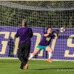Issaquah High alumnus Anna Miller (right) gets in some practice time before the University of Washington match against Seattle University. Photo courtesy of Don Borin/ Stop Action Photography