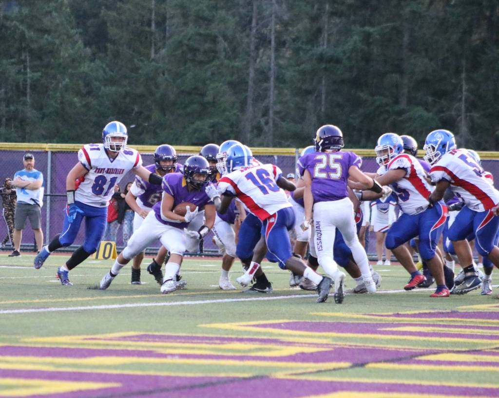 Eagles running back Isaac Pak rushes for a touchdown in the second quarter of their 20-0 victory over Kent-Meridian. Benjamin Olson/ staff photo