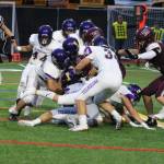 The Eagles defense swarming to the ball during the first quarter of their 12-3 victory over Mercer Island on Sept. 13. Benjamin Olson/ staff photo