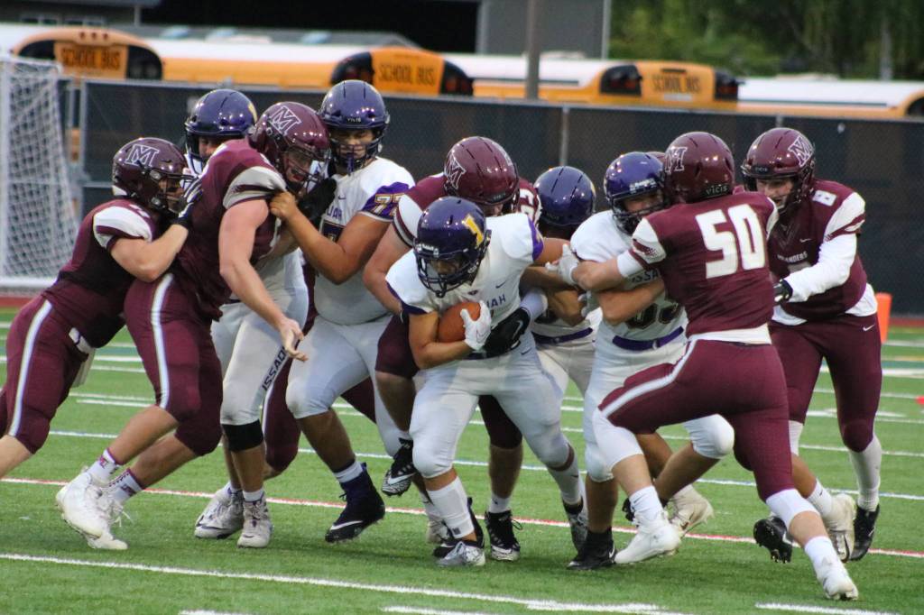 Eagles running back Isaac Pak fights for extra yardage in a 12-3 Issaquah victory on Sept. 13. Benjamin Olson/ staff photo