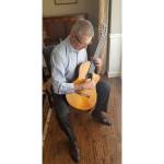 Mercer Island financial adviser Bob Toomey plays a classical guitar. Courtesy photo
