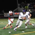 Issaquah quarterback Jack Githens (10) escapes from pressure in a 34-0 loss to Mount Si on Oct. 11. Photo courtesy of Calder Productions