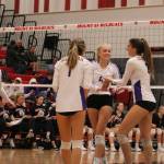 Issaquah volleyball players (from left) Rachel Ratcliffe, Olivia Morgan, Sidney Cottrell and Maya Patton celebrate a point against the Mount Si Wildcats on Oct. 16. Benjamin Olson/staff photo