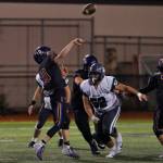 Issaquah quarterback Jack Githens (10) throws the ball with Skyline defensive lineman Tyson Whitfield (52) applying pressure on Oct. 25. Photo courtesy of Jim Nicholson